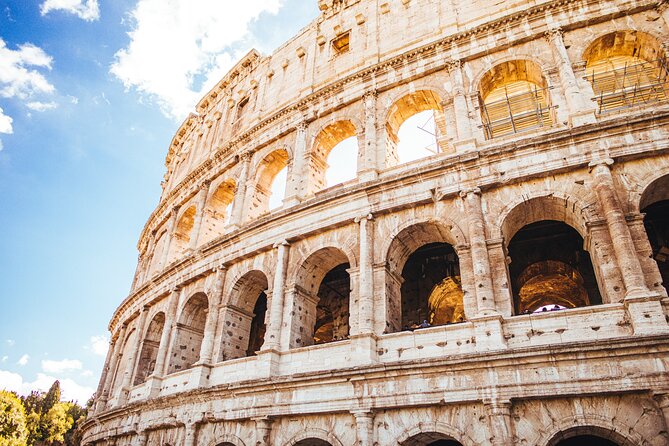 Ancient Rome Discovery: Colosseum, Forum, Palatine Guided Tour - Entering the Colosseum through the first tier