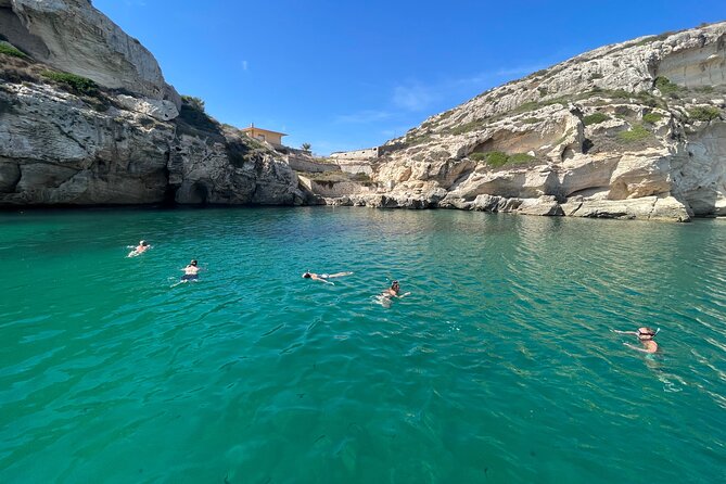 Boat Tour at Devil's Saddle: 4 Swim Stops, Snorkeling & Prosecco - Cala Fighera offers a more dramatic coastal setting
