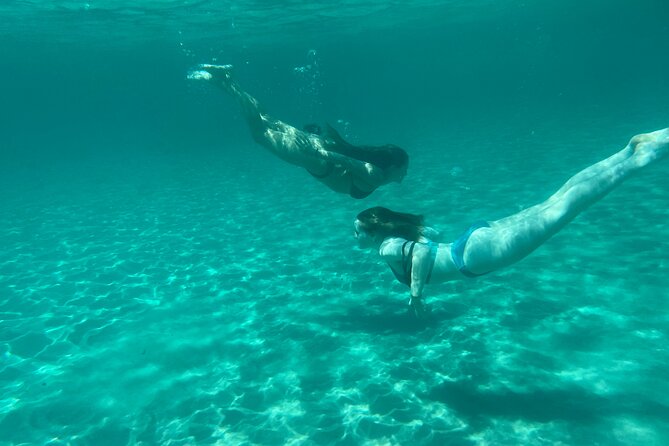 Boat Tour at Devil's Saddle: 4 Swim Stops, Snorkeling & Prosecco - Cala Bernat starts the swimming circuit