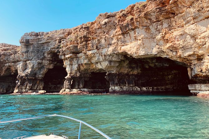 Boat tour of the Polignano a Mare caves with aperitif - The blue light inside Grotta Azzurra