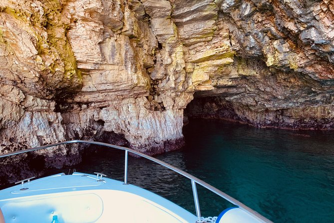 Boat tour of the Polignano a Mare caves with aperitif - Grotta Palazzese and its famous restaurant