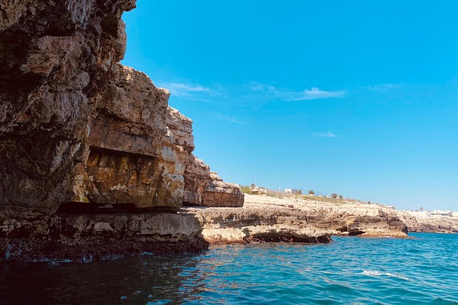 Boat tour of the Polignano a Mare caves with aperitif - Scoglio dell’Eremita and the cross on the rock