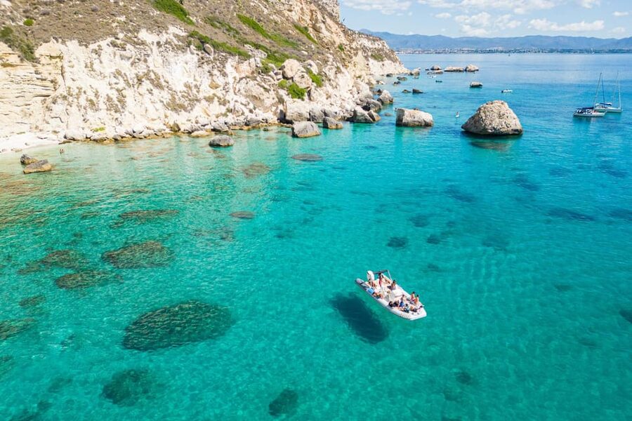 Cagliari: Zodiac Boat Tour, 3-4 SwimStops, Wine & Snorkeling - Cala Fighera: limestone cliffs and clear water