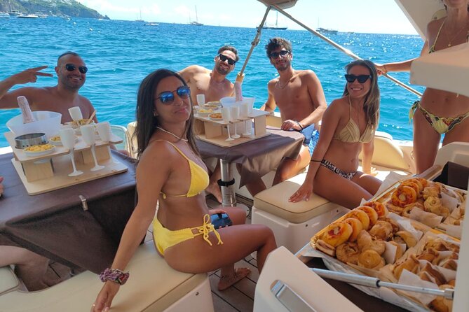 Capri in a Day All Inclusive Premium Boat Tour + City Visit - Coves, caves, and the Punta Carena lighthouse