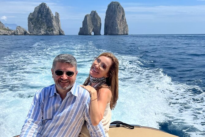 Capri in a Day All Inclusive Premium Boat Tour + City Visit - Casa Malaparte, white rock, and red rock