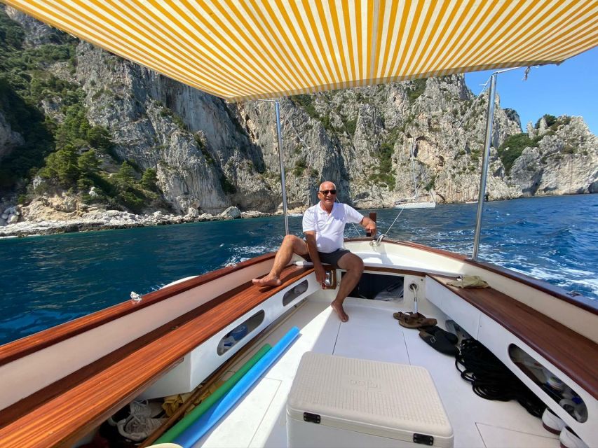 Capri: Island and Grottos Boat Cruise with Snacks and Drinks - The Natural Arch and Casa Malaparte from below