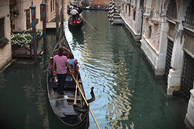 Charming Gondola Ride on the Grand Canal & Gondola Gallery™ - A guided walk toward the gondola