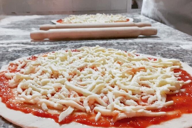 Cooking Class in the Heart of Rome: Pizza and Tiramisu Making - Sitting down to eat your own meal