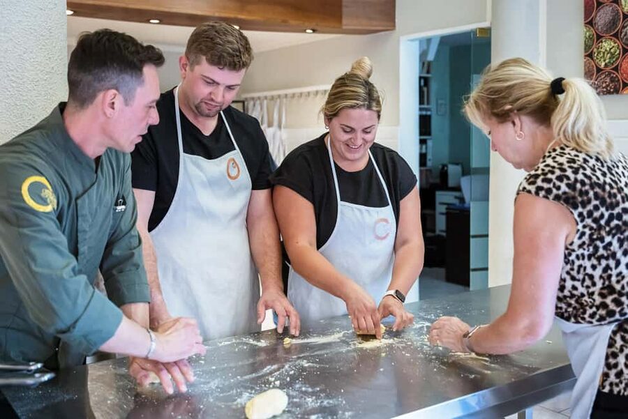 Florence: Handmade Pasta & Dessert Class with Unlimited Wine - Fettuccine, ravioli, and gnocchi at the worktable