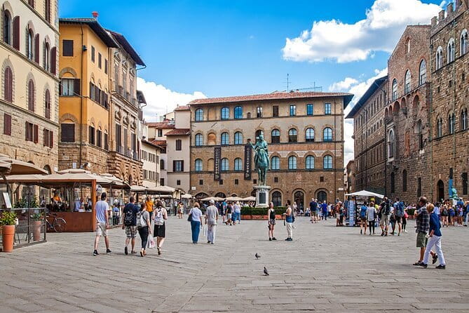 Florence in a Day: David, Cathedral & City Highlights Guided Tour - Piazza della Signoria and the Medici story
