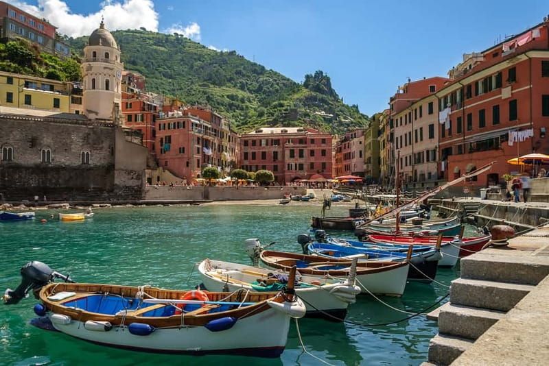 From La Spezia: Cinque Terre Small Group Tour with Limoncino - Riomaggiore: boats, cliffs, and the final village