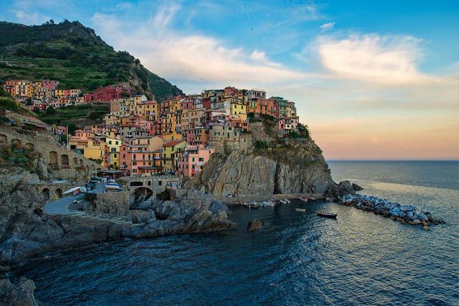 From Milan: Cinque Terre Guided Full-Day Trip With Cruise - Manarola: harbors, rocks, and a short first look