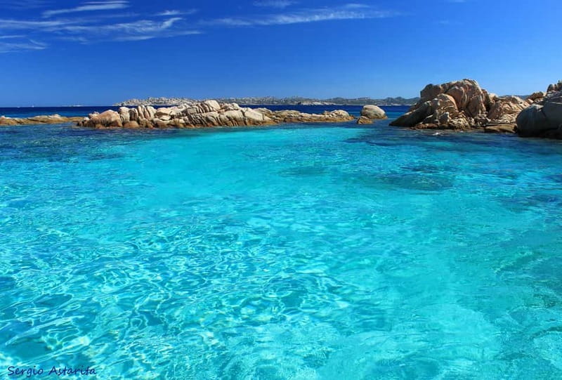 From Palau: 4 stops boat tour to La Maddalena archipelago - Santa Maria gives you the longest early beach break