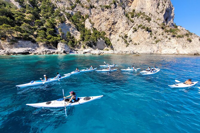 Kayak tour in Capri between caves and beaches. Photos included. - Paddling into Grotta dell’Acqua
