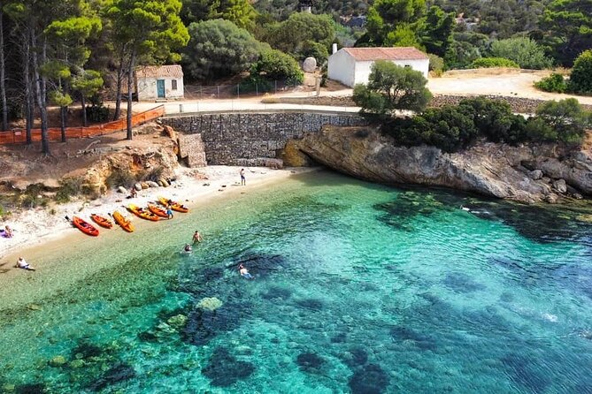 Kayak tour with aperitif and dolphins - Paddling toward Cala Moresca’s coves