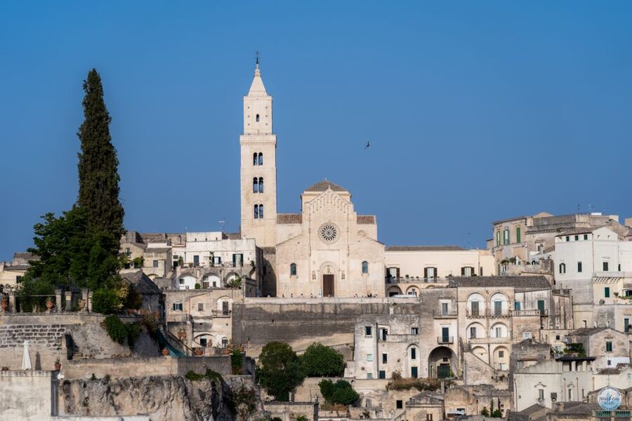 Matera: Sassi Tour with Entry to Rock Houses and Churches - Walking through the historic center to Piazza Duomo