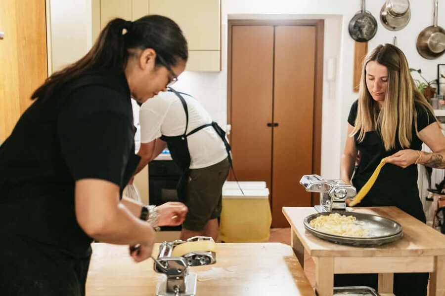 Milan: Pasta & Tiramisu Cooking Class with Premium Products - Sitting down for the family-style meal