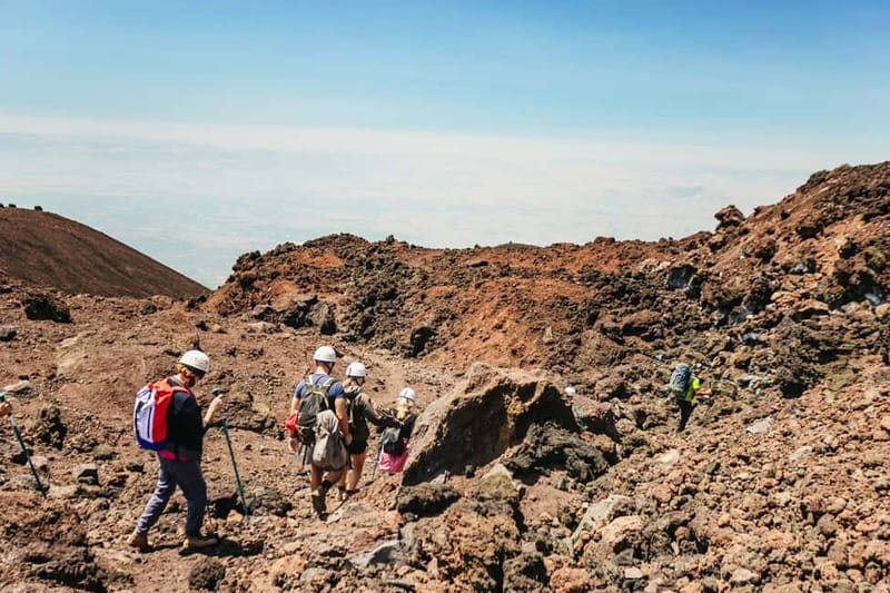 Mount Etna: Summit Trek with Cable Car and snack included - Walking through Etna’s upper volcanic zone