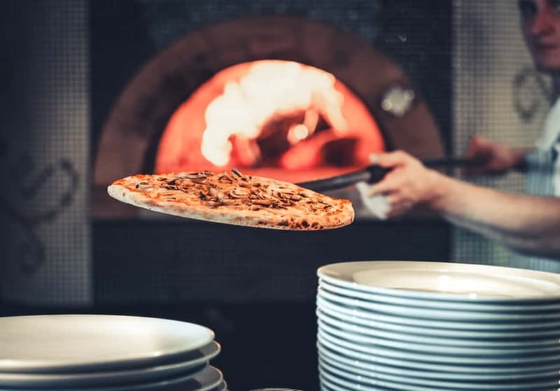 Naples: Premium Pizza-Making Class at a Pizzeria - Stretching, topping, and baking your Margherita