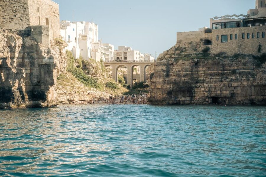 Polignano Sea Caves: Boat Tour with Snorkeling & Aperitif - Lama Monachile is the postcard moment