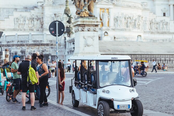Private Evening Golf Cart Tour of Rome with Aperitivo - The Colosseum under evening lights