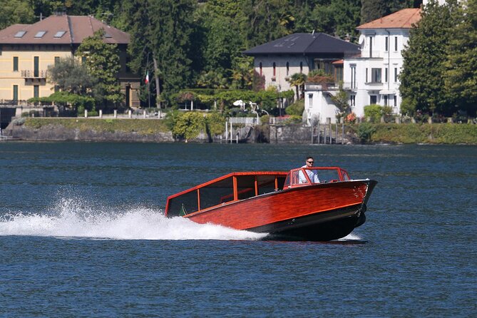 Private Tour by Classic Wooden Boat on Lake Como - Leaving Como beside Life Electric