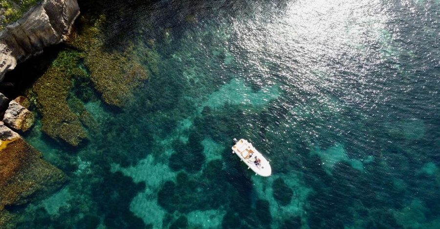 Procida: Boat Tour with Swimming Stops and Underwater Photos - Leaving Marina Grande near the ferry landing
