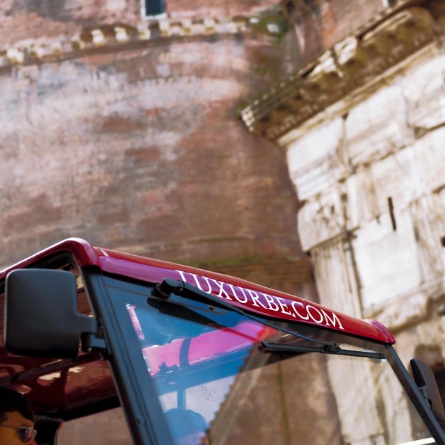 Rome: City Golf Cart at Night Tour - The Colosseum under evening lights