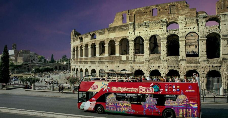 Rome: City Highlights Open-Top Bus Night Tour - The Colosseum under Rome’s night lights