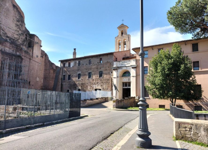Rome: Colosseum, Roman Forum, and Palatine Hill Ancient Tour - Walking through the Roman Forum