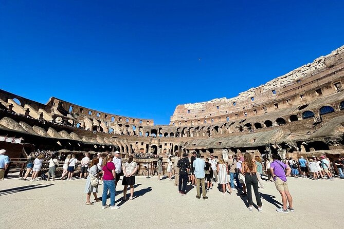 Rome: Colosseum, Roman Forum & Palatine Hill Visit + Audio Guide - Entering the Colosseum on a timed ticket