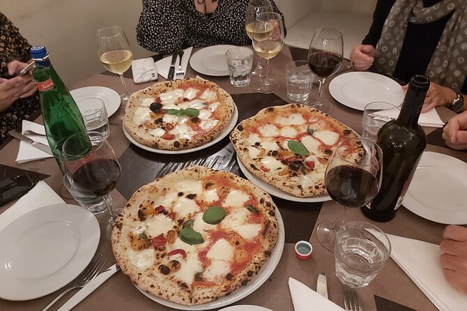 Rome: Pizza & Tiramisu Class with Free Flowing Fine Wine - Sitting down to eat your own work