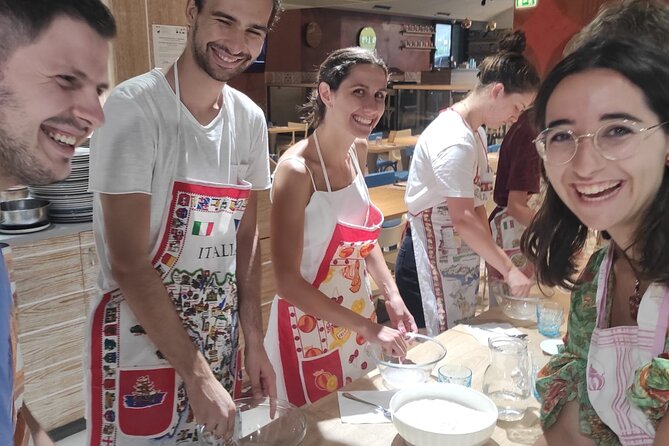 Semi-Private Pizza Making Experience in Naples with Drink - Sitting down with your pizza and a drink