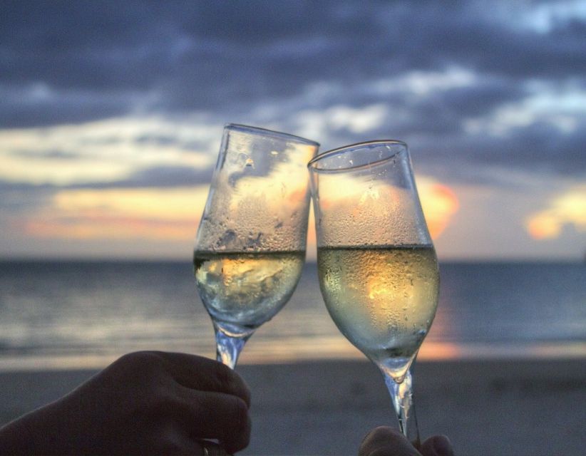 Sirmione: Sunset Boat Cruise with Local Wine - Leaving the harbor with Sirmione Castle overhead