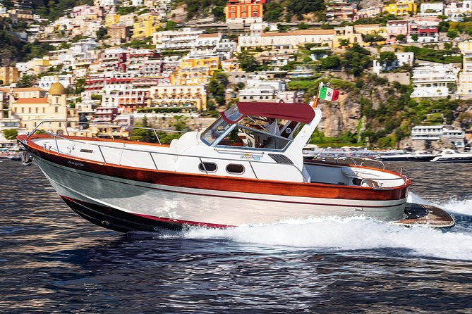 Small Group Boat Day Excursion to the Amalfi Coast from Sorrento - Positano: shops, sandals, and a steep climb