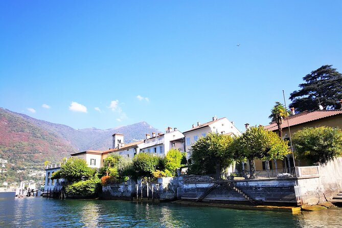Small-Group Lake Como & Lugano by Swiss Train + Boat Cruise - Lake Como by boat, with villas from the water