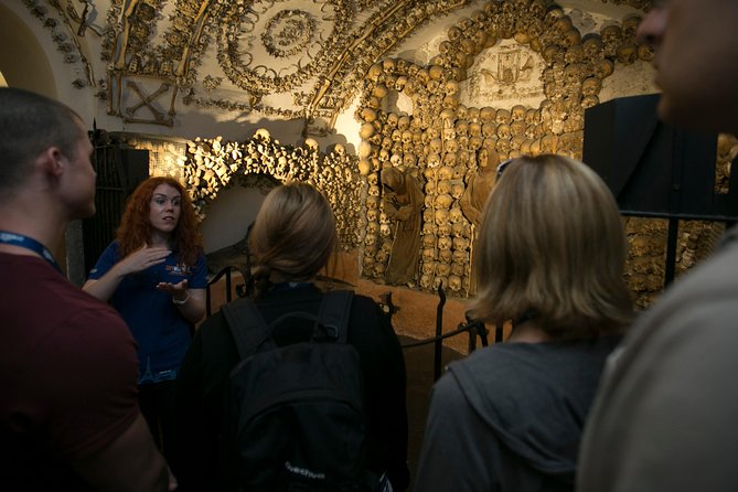 The Original Roman Crypts and Catacombs Tour with Transfers - Walking through the Domitilla Catacombs