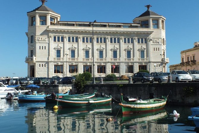Tour of the island of Ortigia and exploration of sea caves with baths. - The swim stop in clear Ionian water