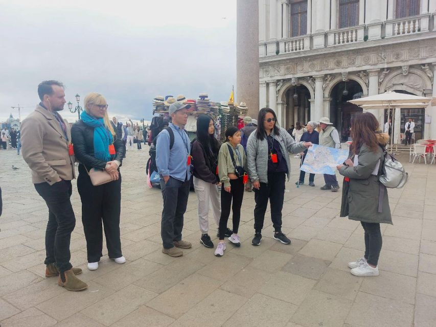 Venice: St. Mark's Basilica Ticket with Audio Guide - Meeting the host beneath Venice’s blue Clock Tower