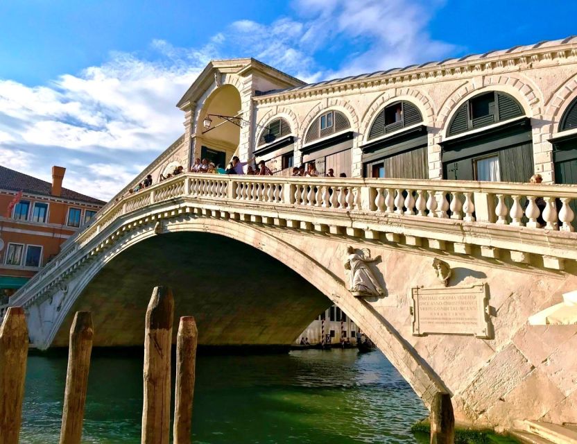 Venice Walking Tour and Gondola Ride Combo - Boarding the gondola for the smaller canals